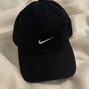 Classic Nike Black hat with embroidered white Nike swoosh logo  
excellent hat.